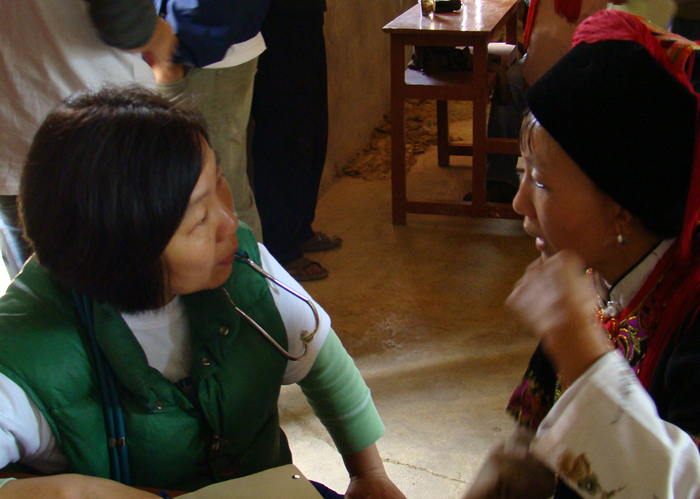 Professor Zhao talks with patient